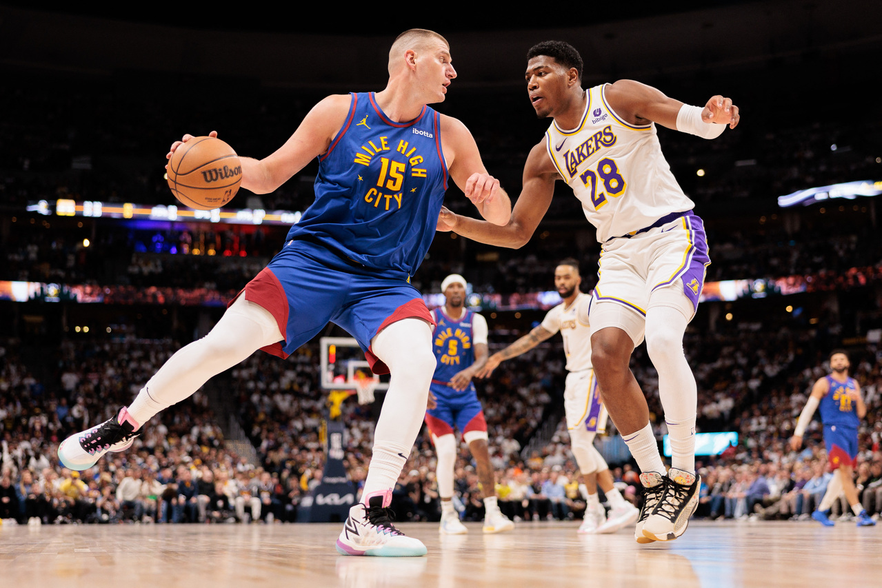 Apr 20, 2024; Denver, Colorado, USA; Denver Nuggets center Nikola Jokic (15) drives to the basket against Los Angeles Lakers forward Rui Hachimura (28) during the second quarter in game one of the first round for the 2024 NBA playoffs at Ball Arena. Mandatory Credit: Andrew Wevers-USA TODAY Sports